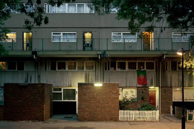 A closely cropped photograph of the Heygate Estate in London taken at night.